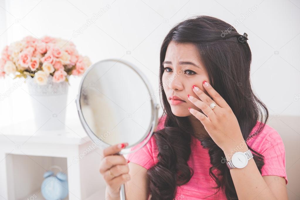 Woman holding a mirror