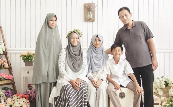 Happy family on decorated room — Stock Photo, Image