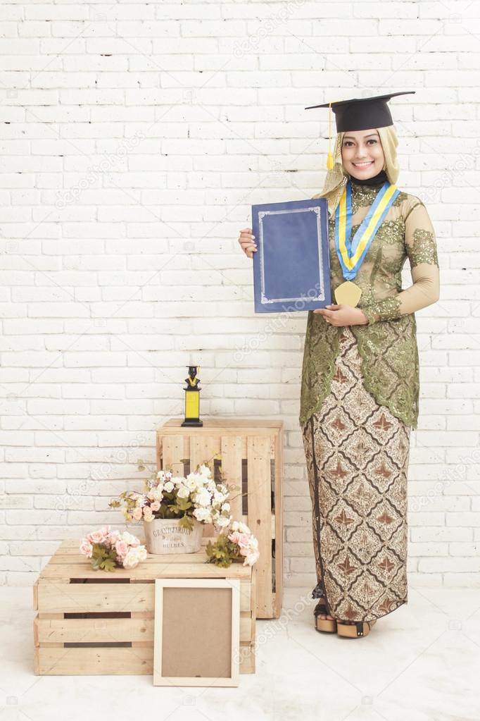 indonesia female graduated student wearing traditional clothes