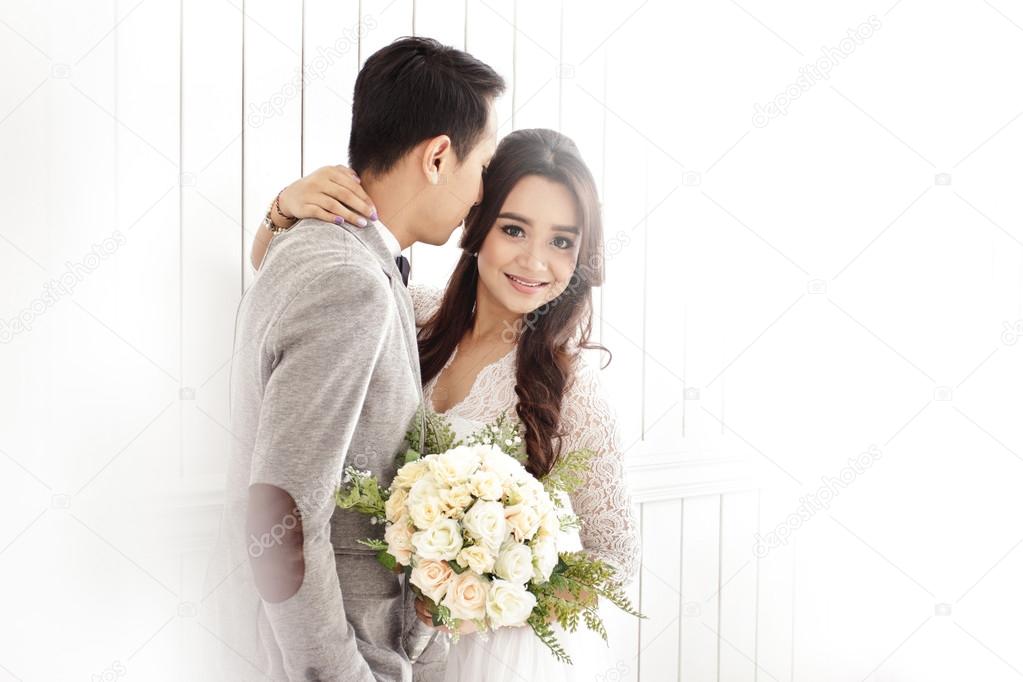 romantic asian newlywed couple 