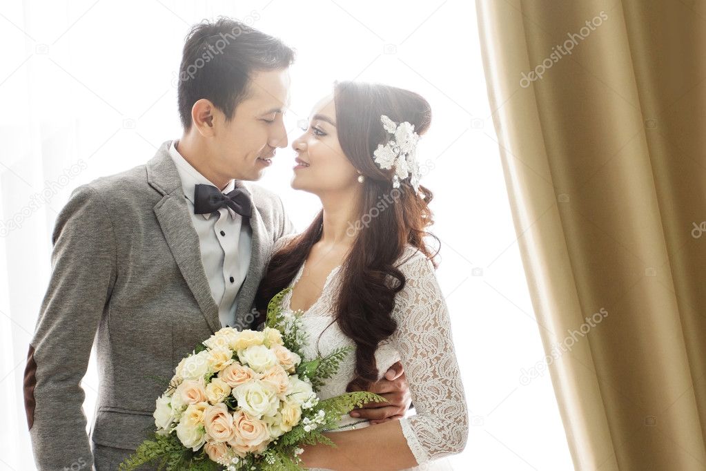 romantic asian newlywed couple