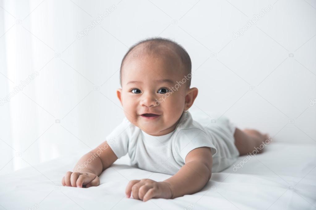 smiling happy baby tummy time