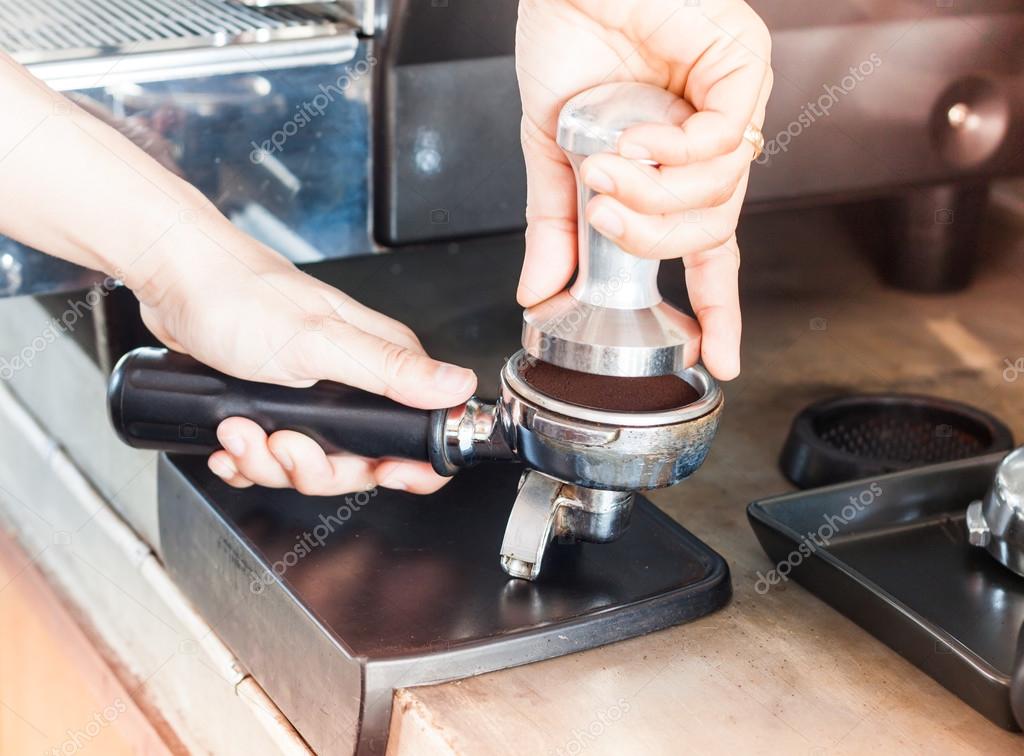 Barista with tamper for making espresso with vintage style