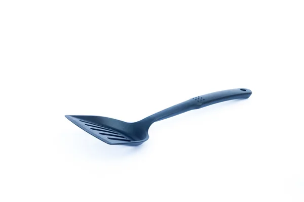 Beyaz arka planda siyah plastik mutfak spatula — Stok fotoğraf