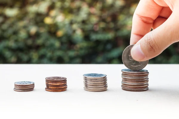 Woman hand putting money coin