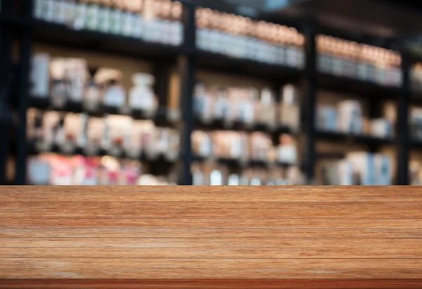 Mesa de madera superior en la cafetería fondo borroso — Foto de Stock