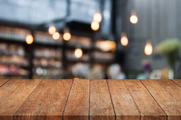 Perspektivy stolní deska dřevěná s café rozmazané pozadí — Stock fotografie