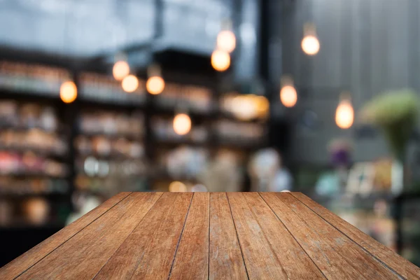 Perspectiva de madera en la cafetería fondo borroso con bokeh — Foto de Stock