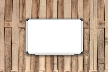 Sepya filtre ile bambu çit üzerinde boş beyaz tahta