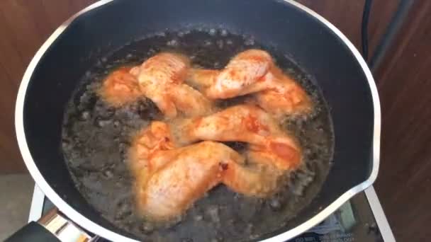 Time lapse cooking chicken wings fried in pan — Stock Video