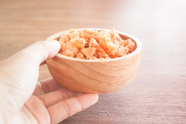 Fried shrimp chins snack in wooden bowl — Stock Photo, Image