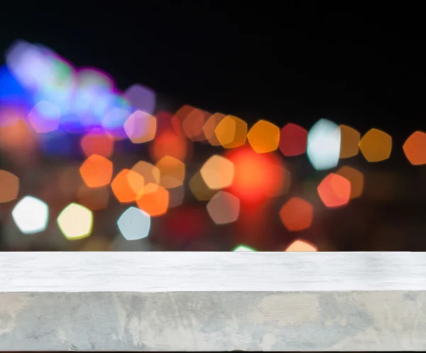 Soyut bulanık ışıkları ile beton masa üstü — Stok fotoğraf