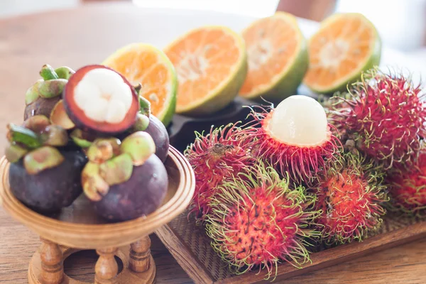 Thai tropical fruit on wooden table — Stock Photo, Image