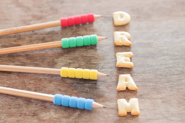 Droom alfabet biscuit op houten tafel — Stockfoto