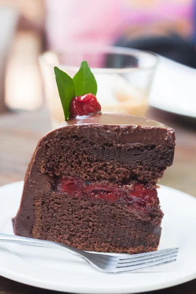 Piece of chocolate cake on white plate — Stock Photo, Image