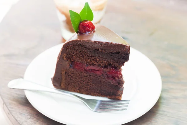 Piece of chocolate cake on white plate — Stock Photo, Image