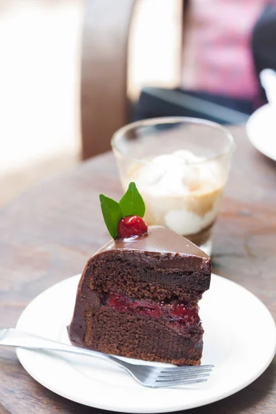 Piece of chocolate cake on white plate — Stock Photo, Image