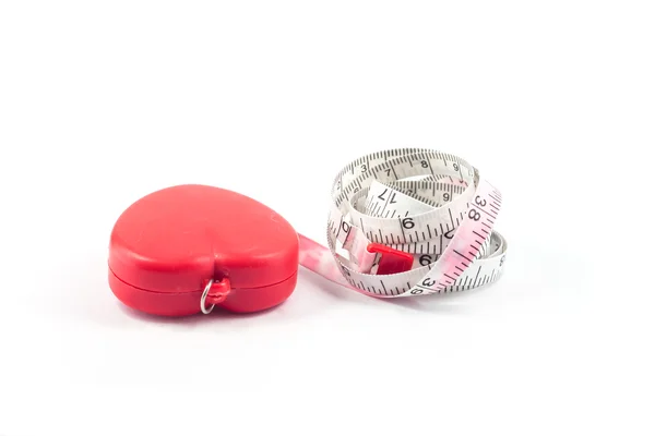 Measuring tape in heart shape on white background — Stock Photo, Image