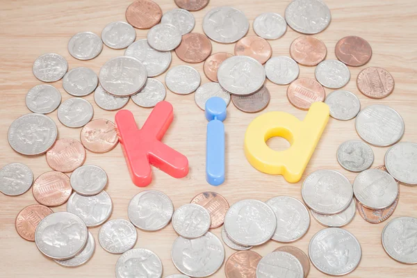 Kid alphabet with various US coins