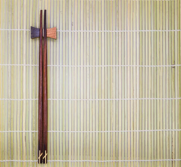Chopsticks na esteira de bambu — Fotografia de Stock