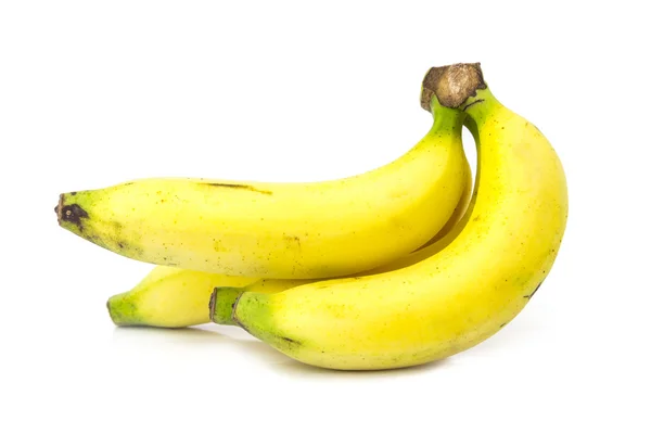 Bananer över vita — Stockfoto