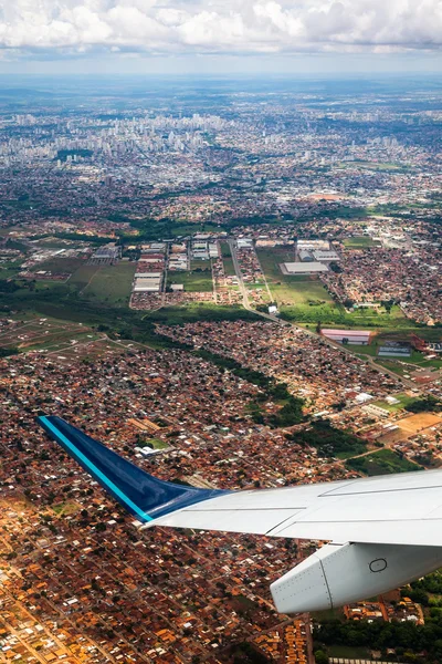 City with airplane wing Royalty Free Stock Photos