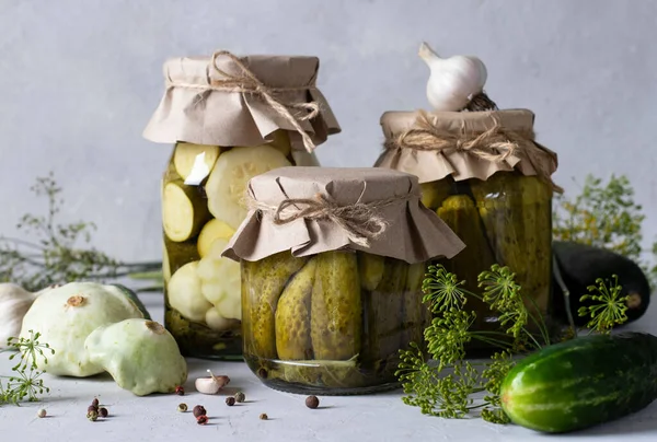 Homemade Pickled Cucumbers Patissons Zucchini Glass Jars Light Gray Background — Stock Photo, Image