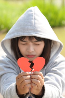 Sad Girl Praying to Reconcile from Broken Heart clipart