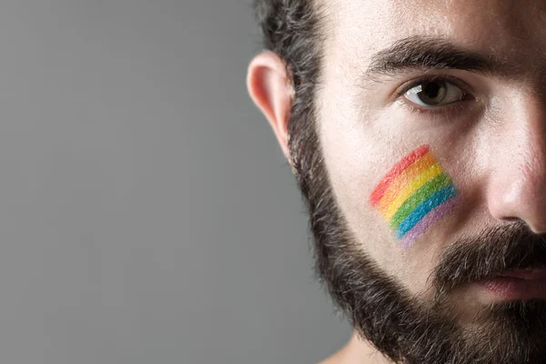 Uomo con guance arcobaleno — Foto Stock