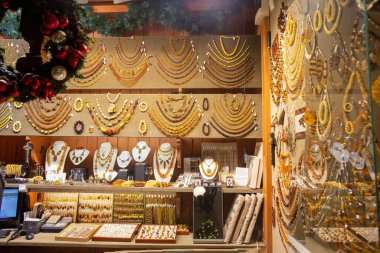  amber shop in krakow-  various chains , pendants, rings, earrings necklace, jewelry fot hands,  clipart