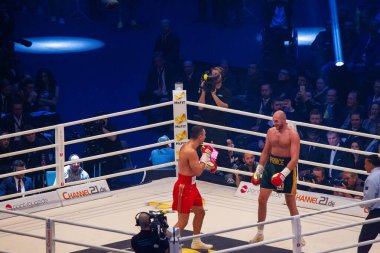 Tyson Fury  (smiling) and Wladimir Klitschko  on ring . Esprit Arena clipart