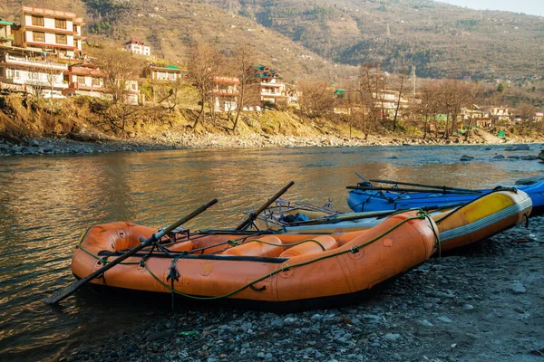 Boats after descend : waiting when owner deliver them  to upper point on river Bea