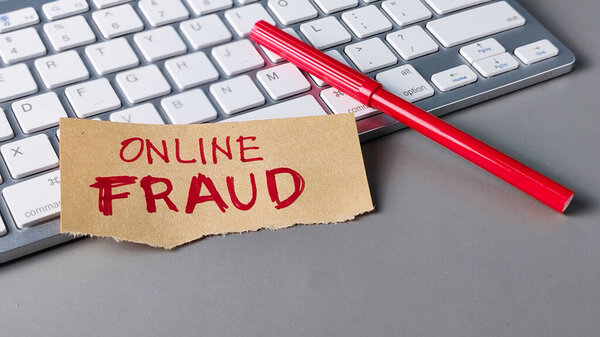 Online Fraud Warning Note on Keyboard: Cybercrime, Internet Security, and Digital Scam Concept