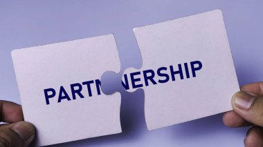 Partnership and Collaboration Concept with Two Jigsaw Puzzle Pieces Connecting Together