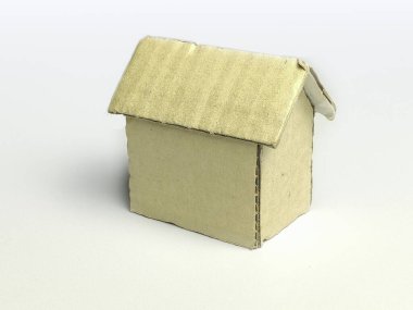 Beyaz arka planda yuvarlak kartondan yapılmış el yapımı minyatür ev modeli