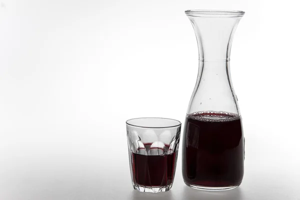 Red wine in decanter and glass — Stock Photo, Image