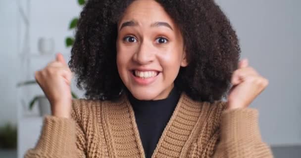 Portrait happy successful afro american woman enthusiastic motivated girl looking at camera shouting with happiness joy making victory gesture celebrating triumph good news getting high appreciation — Stock Video