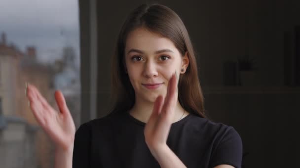 Portrait of grateful woman millennial caucasian girl looking at camera applauding hands claping palms, gesture of approval, expressing admiration congratulating with success demonstrates her opinion — Stock video