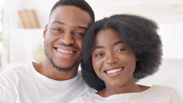 Webcam view happy loving african american married couple newlyweds afro family curly beautiful woman and ethnic black man hugging cuddling talking on video call conference online smiling videocalling – Stock-video