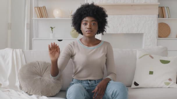 Unhappy focused serious young African American beautiful woman showing stop sign to camera, protesting against domestic violence or abuse bullying, racial or gender discrimination, keeping distance — Αρχείο Βίντεο