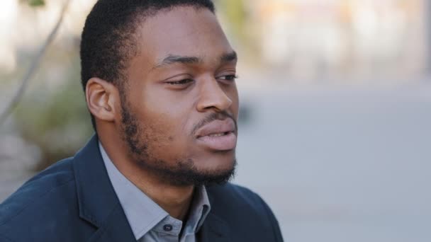 Closeup Business portrait of confident male ceo executive manager in suit thinking of development strategy. Pensive African man deep in sad thoughts looks out considering of problems, life troubles — Stock Video