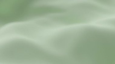 Yumuşak yeşil ipek kumaş yumuşak dalgalar oluşturarak zarif minimum arkaplan dokusu yaratarak tazeliği, sakinliği ve tasarım, video veya dekor için lüks estetiği sembolize eder.