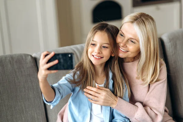 happy smiling grandma mom granddaughter selfie