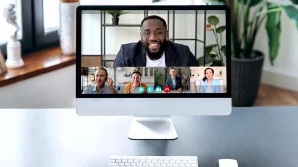 Brainstorm, distant communication, online learning. A computer monitor view with many different multiracial business partners gathered in a video conference, discuss ideas and strategy, video call — Wideo stockowe