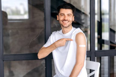 Vaccination and immunity concept. Happy healthy caucasian male received the covid19 vaccine, immunity of viruses and infections. Healthcare and medicine