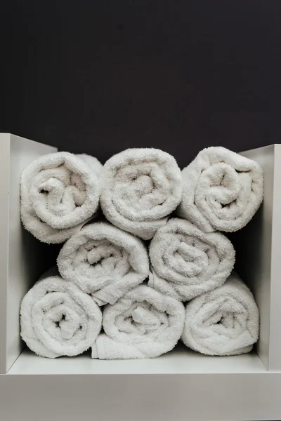 Stack of towels on simple background — Stock Photo, Image