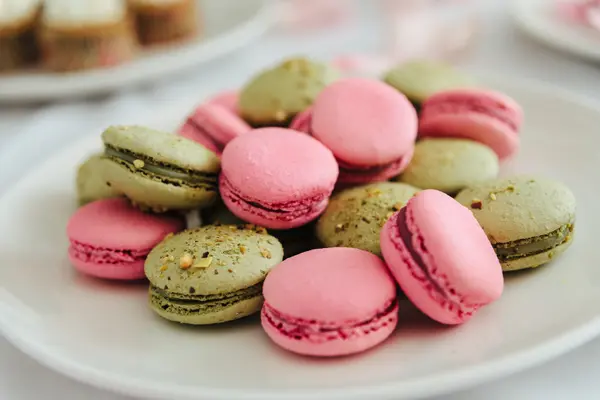 Fresh macarons on white plate — Stock Photo, Image