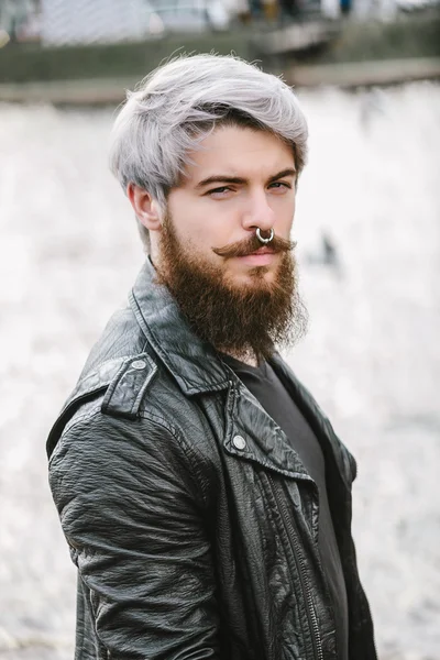 Bearded hipster with nose ring in leather jacket — Zdjęcie stockowe