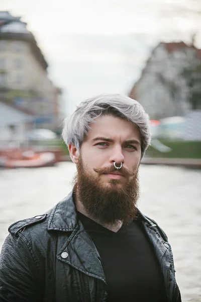 Bearded hipster with nose ring in leather jacket — Stock Photo, Image