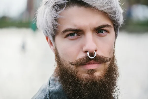 Bearded hipster with nose ring in leather jacket — 图库照片